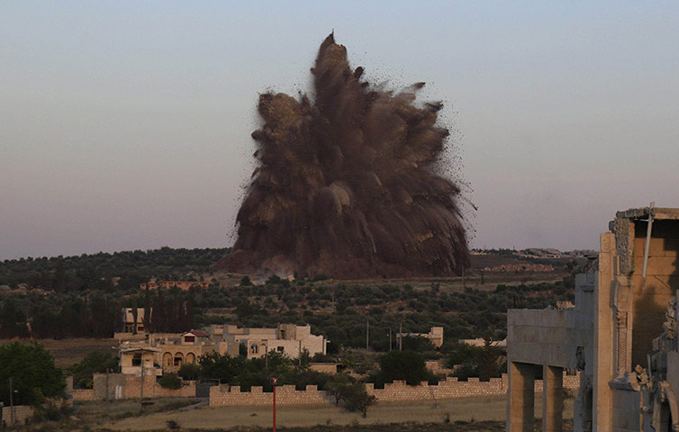 20 Photos: Debris rises after a tunnel was targeted in Idlib province