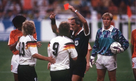 The referee dismisses Rudi Voeller.