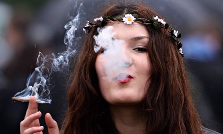 A woman smokes cannabis at a '420 Day' event in London's Hyde Park calling for cannabis legalisation