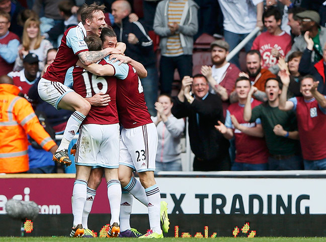 saturday round up: Stewart Downing of West Ham United is mobbed by team mates