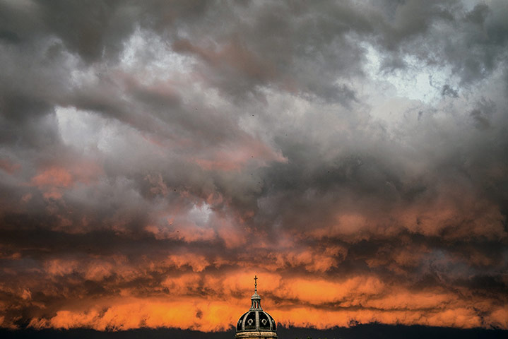 20 photos: A storm gathers above the Saint-Bruno des Chartreux church in Lyon, France