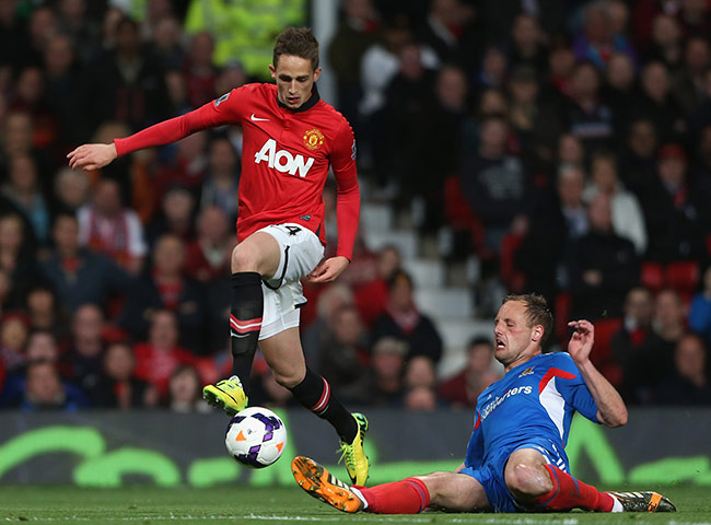 Hull Manchester United: Manchester United's Januzaj jumps over David Meyler's challenge