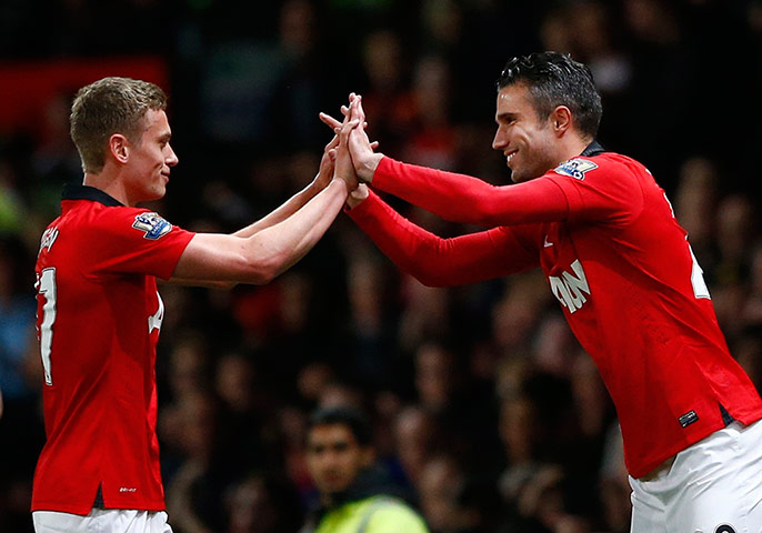 Hull Manchester United: James Wilson is congratulated by teammate Van Persie as he is substituted