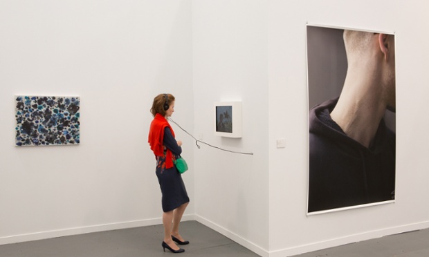 Frieze New York 2014: A visitor plugs in to a video installation at Maureen Paley's stand.