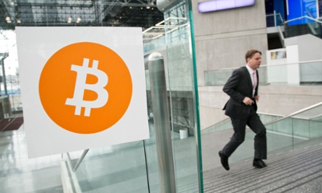 A man enters a bitcoin conference in New York.