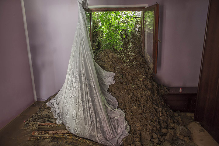 20 Photos: A pile of mud is seen inside a living room in Krupanj