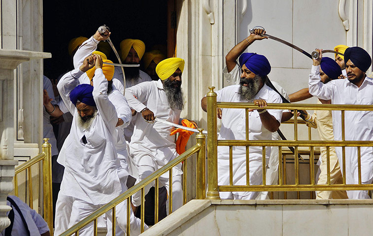 20 Photos: Sikhs wield swords at the holy Sikh shrine, the Golden Temple, in Amritsar