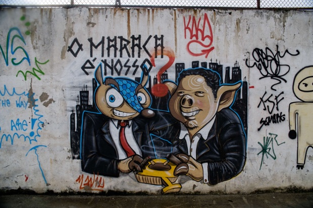 A graffiti depicting Tatubola, the mascot of the upcoming FIFA World Cup on a wall of the Maracana metro station.