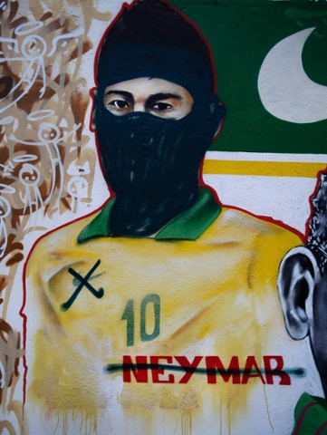 Graffiti over a mural featuring Neymar, has been modified to make the Barcelona striker look like a member of the Black Blocs, which have been active in Brazil's ongoing protest movement against the World Cup.