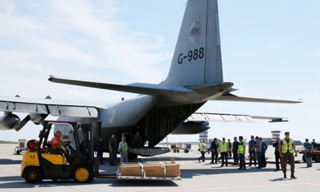 MH17 victims loaded onto a transport plane at Kharkiv airport
