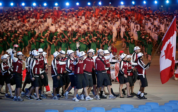 opening ceremonies: The Canada team arrives sporting rather casual attire