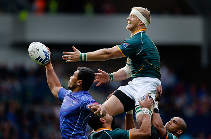 Rugby Sevens TJ: Lolo Lui of Samoa steals a line-out in front of Kyle Brown of South Africa