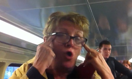 Woman's racist abuse filmed on packed train in Sydney