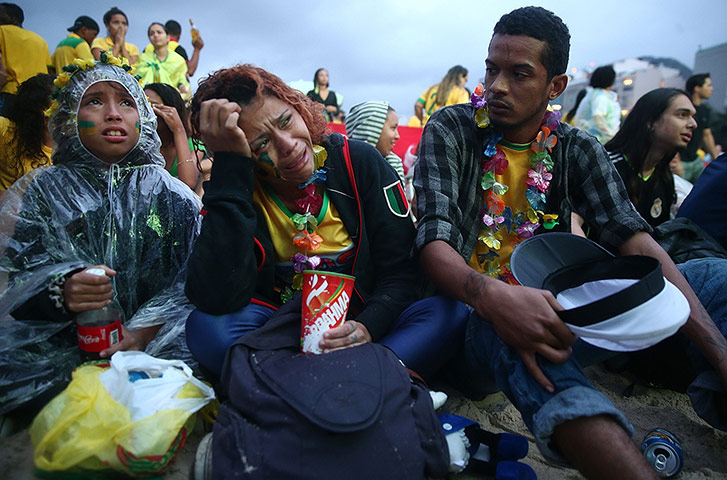 Brazilians in shock-: Brazilian Fans Cheer On Their National Team During World Cup Semi Finals
