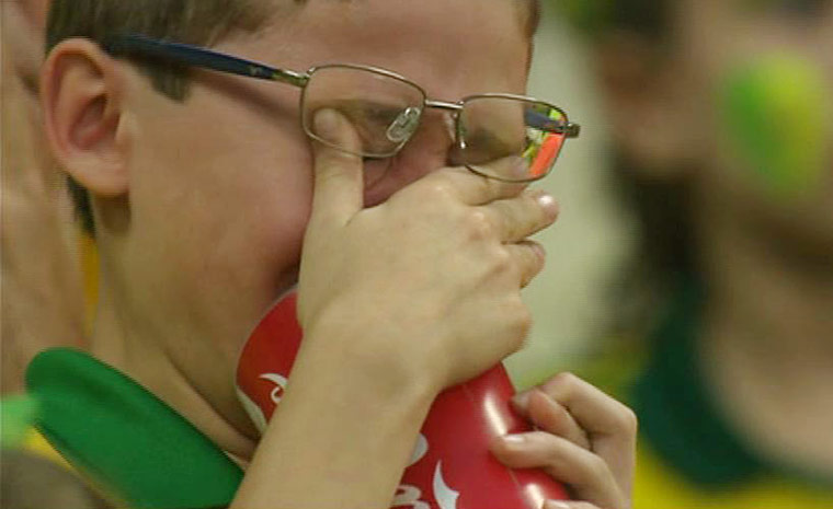 brazil mourns: Brazil fan crying after the fourth goal went in