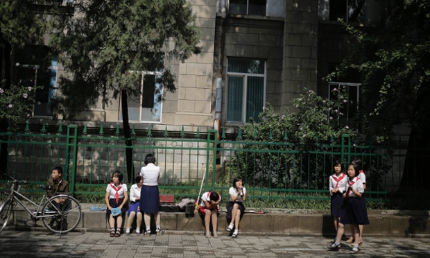 North Korean students wait for their turn to perform during celebrations for the anniversary of the Korean War armistice agreement Sunday, July 27, 2014, in Pyongyang, North Korea. North Koreans gathered at the Kim Il Sung Square as part of celebrations for the 61st anniversary of the armistice that ended the Korean War.