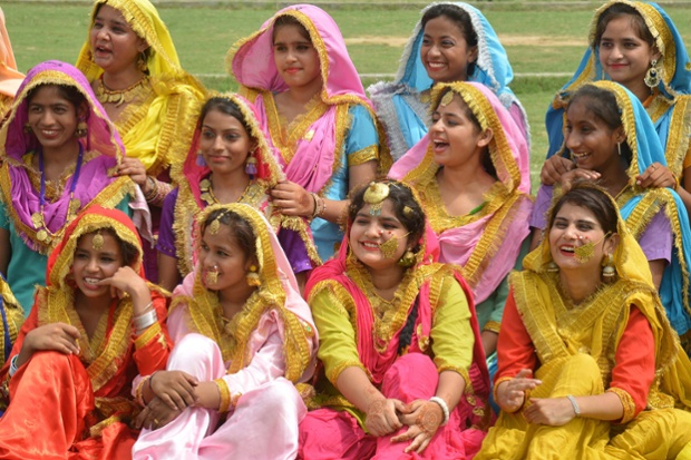 Schoolgirls wear traditional Punjabi dress during a ceremony at the Guru Nanak stadium in Amritsar
