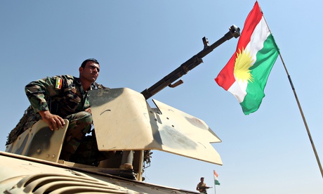 Iraqi Kurdish peshmerga fighter monitors area near Mosul dam