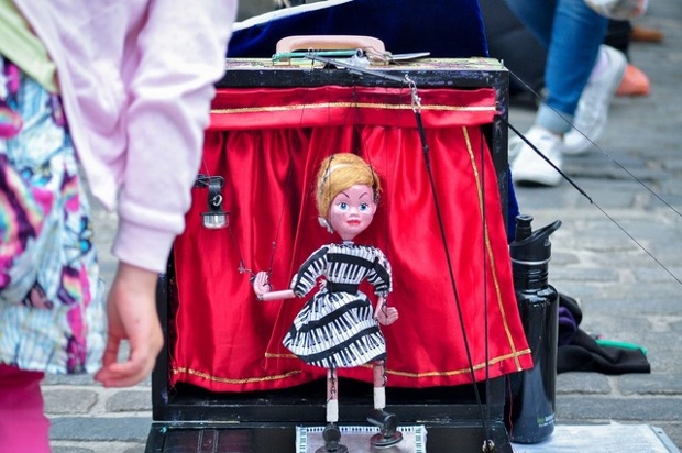 Nice strings. 'Here's my daughter about to leave some money in the box.'