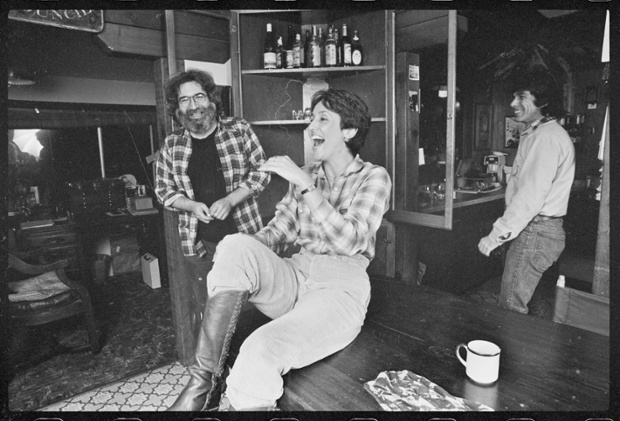 Joan Baez shares a joke with Jerry Garcia at the Grateful Dead leader's California home in 1981