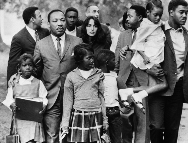 Martin Luther King, Jr. and Baez lead a group of children to their newly integrated school in Grenada, Mississippi in September 1966