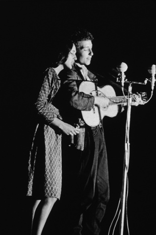 Joan Baez and Bob Dylan perform together onstage, 1963