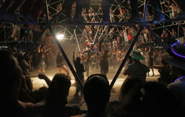 A crowd watches as two fighters battle in the Thunderdome.