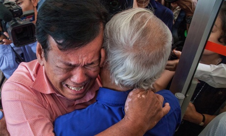 Two survivors cry after hearing the guilty verdict for former Khmer Rouge leaders for crimes against humanity.