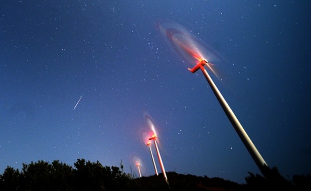 'Meteor falling above windmill farm: A meteor streaks across the sky during the Perseid meteor shower at a windmill farm near Bogdanci, south of Skopje, in the early morning August 13, 2014.'