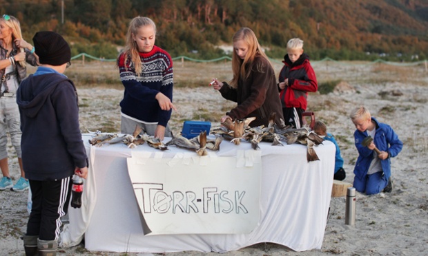 Local girls sell Torr Fisk (dried fish) on the beach. The snack is a local speciality and it takes up to three weeks to dry the fish, which is usually cod. The fish needs to be hammered with a mallet to soften it before eating.