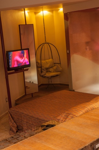 A birdcage style chair add a bit of fun for hotel guests.