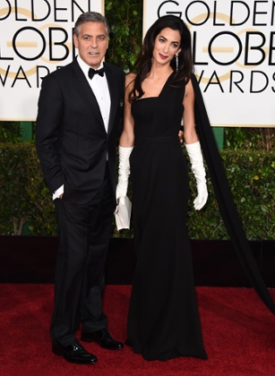 George Clooney, left, and Amal Clooney arrive at the Golden Globes.