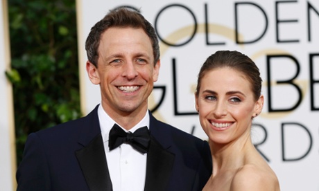 Television host Seth Meyers (L) and his wife Alexi arrive at the Golden Globes.