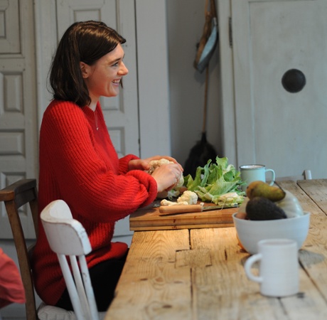 a lady making a salad