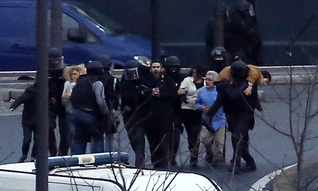 Charlie Hebdo attack: Hollande confirms four killed in Paris – live updates