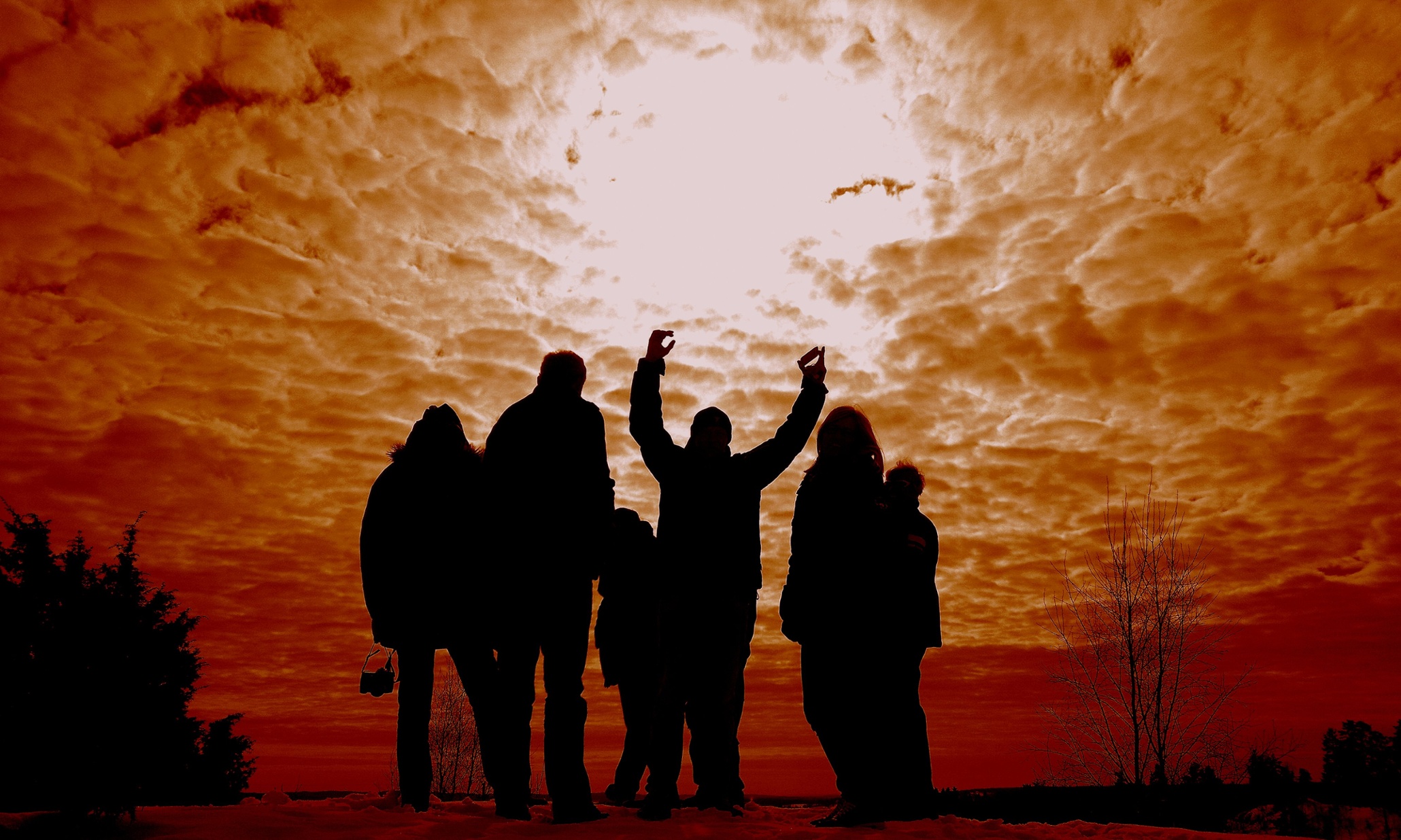 People cheering at the sky