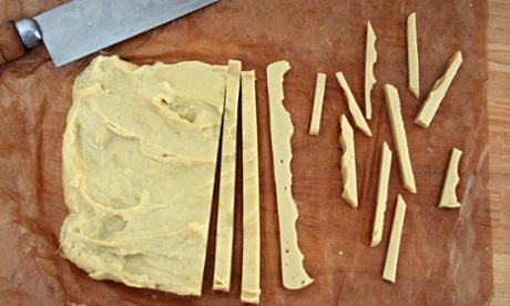 Chickpea batter sliced into chips.