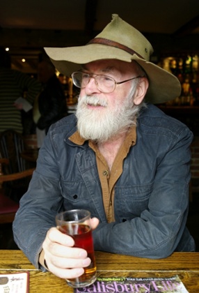 Terry Pratchett enjoys a half pint of Badger Ale in his local pub The Queen’s Head, Broad Chalke, Wiltshire, in 2012