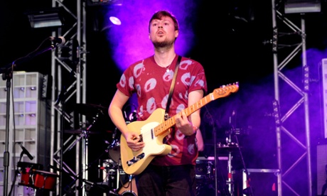 Django Django's Vincent Neff on stage with the band at Bestival in 2012.