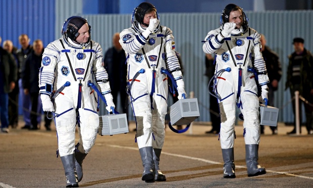 Astronauts blast off for year-long stay on space station - video