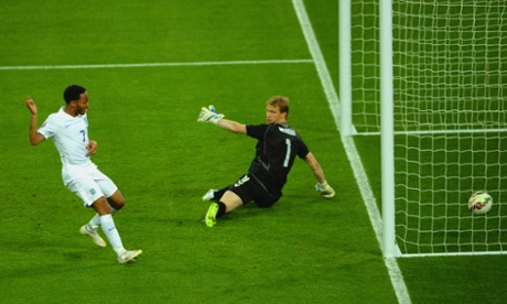 Raheem Sterling scores England's third goal past Giedrius Arlauskis.