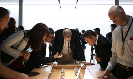 The audience take a closer look at the new Apple Watch designs after Tim Cook's launch presentation.
