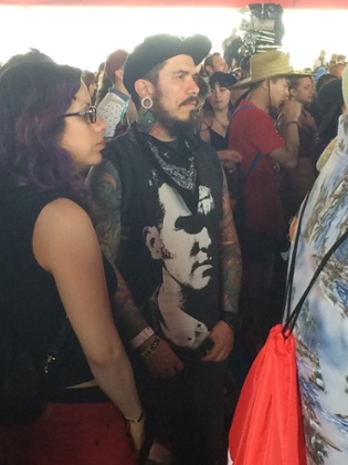 A Morrissey fan watches Kimbra at Coachella.