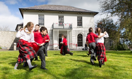 Pupils from Ysgol Gynradd Aberteifi perform a traditional Welsh dance in the grounds of the refurbished Cardigan Castle