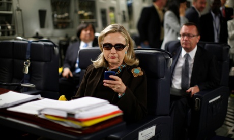 In 2011, Hillary Clinton wears sunglasses inside a C-17 military plane bound for Tripoli