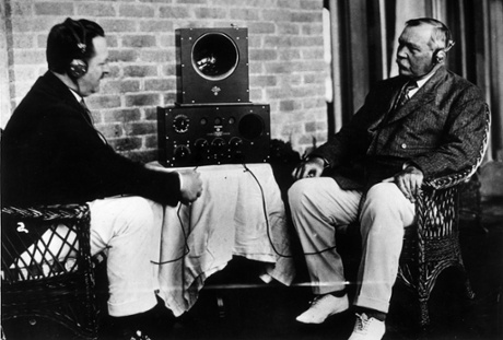Holmes service … Sir Arthur Conan Doyle, right, and a friend listen to a radio in 1922.