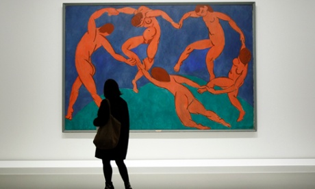 A visitor looks at The Dance by Henri Matisse as part of the opening of the exhibition