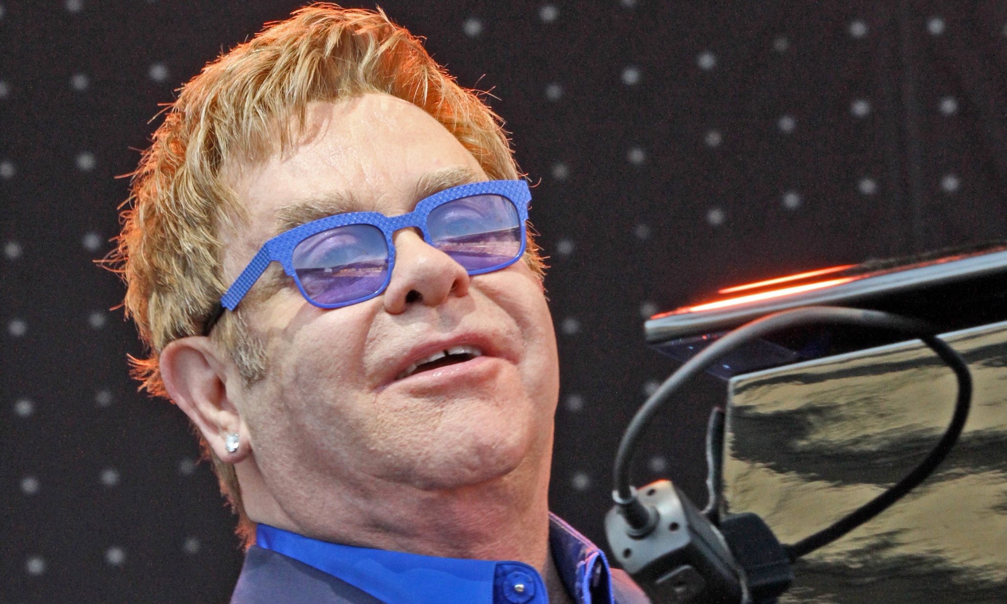 Elton John & Michael Stipe call for protection of transgender inmates