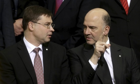 European commission vice-president Valdis Dombrovskis (left) speaks to European commissioner for rconomic and financial affairs Pierre Moscovici in Riga.