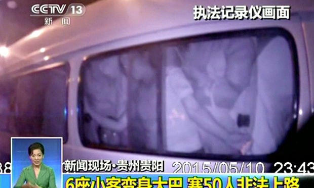 Chinese police discover 50 people travelling in mini van - video - The Guardian